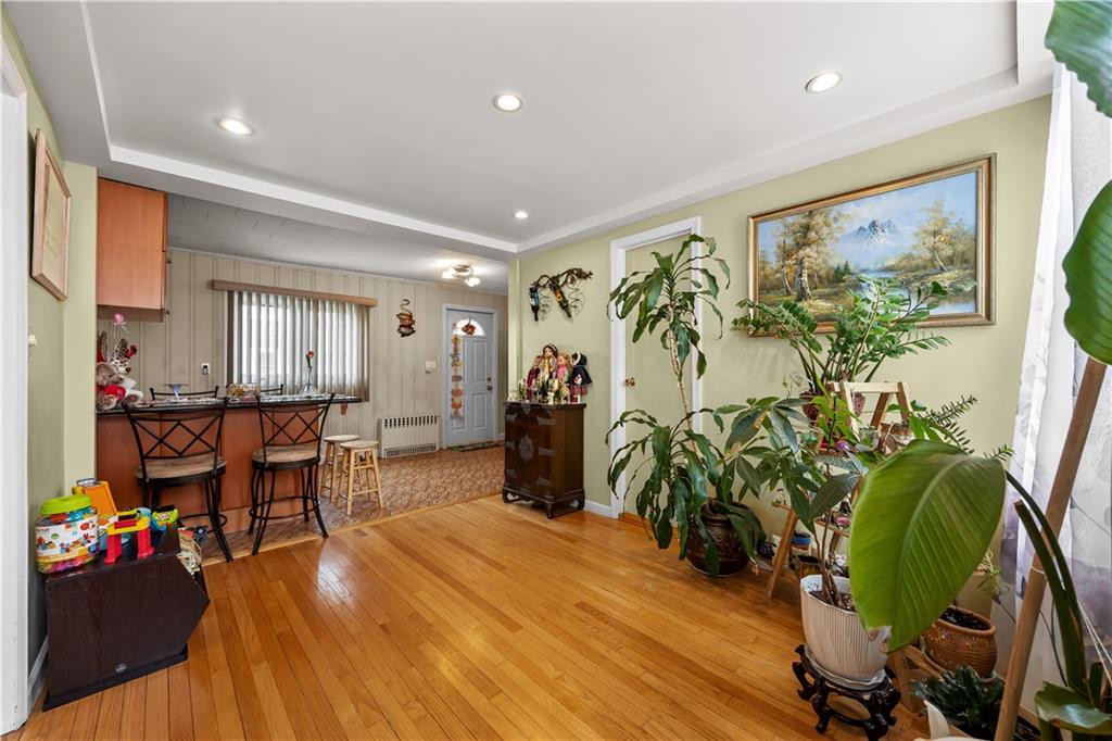 8 Lester Court Brooklyn, NY 11229 - Photo 6 of 25 a living room with furniture and a potted plant