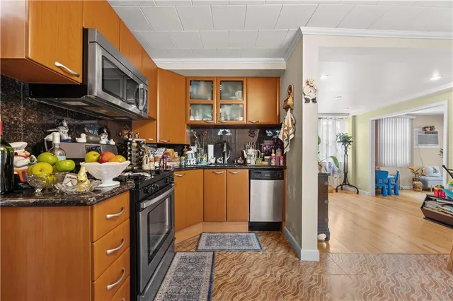 a view of a living room kitchen and a window