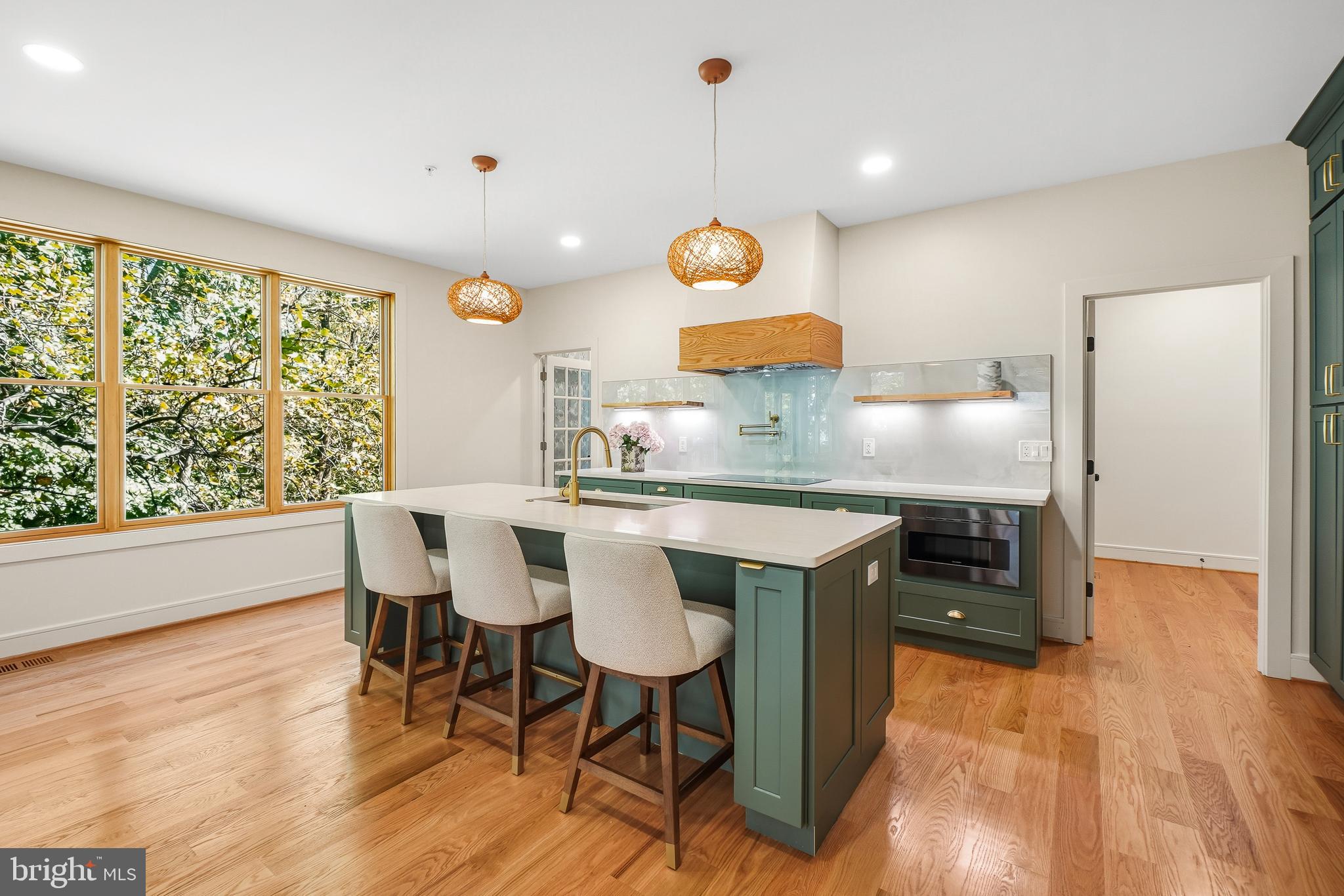 110 Geneva Avenue Silver Spring, MD 20910 - Photo 19 of 61 an open kitchen with wooden floor and large window