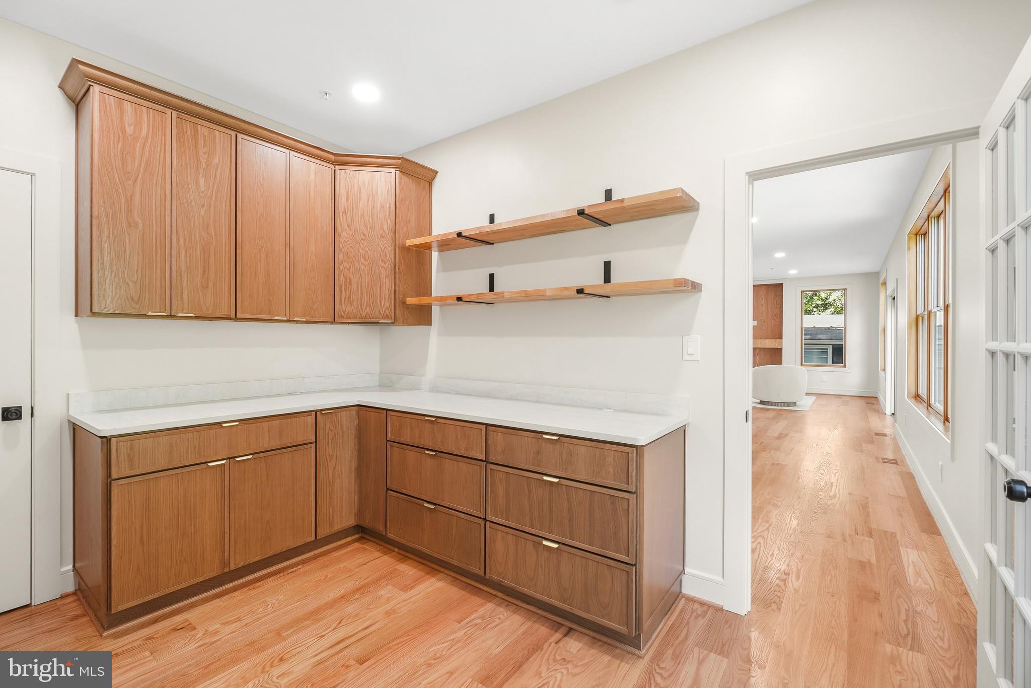 110 Geneva Avenue Silver Spring, MD 20910 - Photo 23 of 61 a kitchen with a sink cabinets and wooden floor