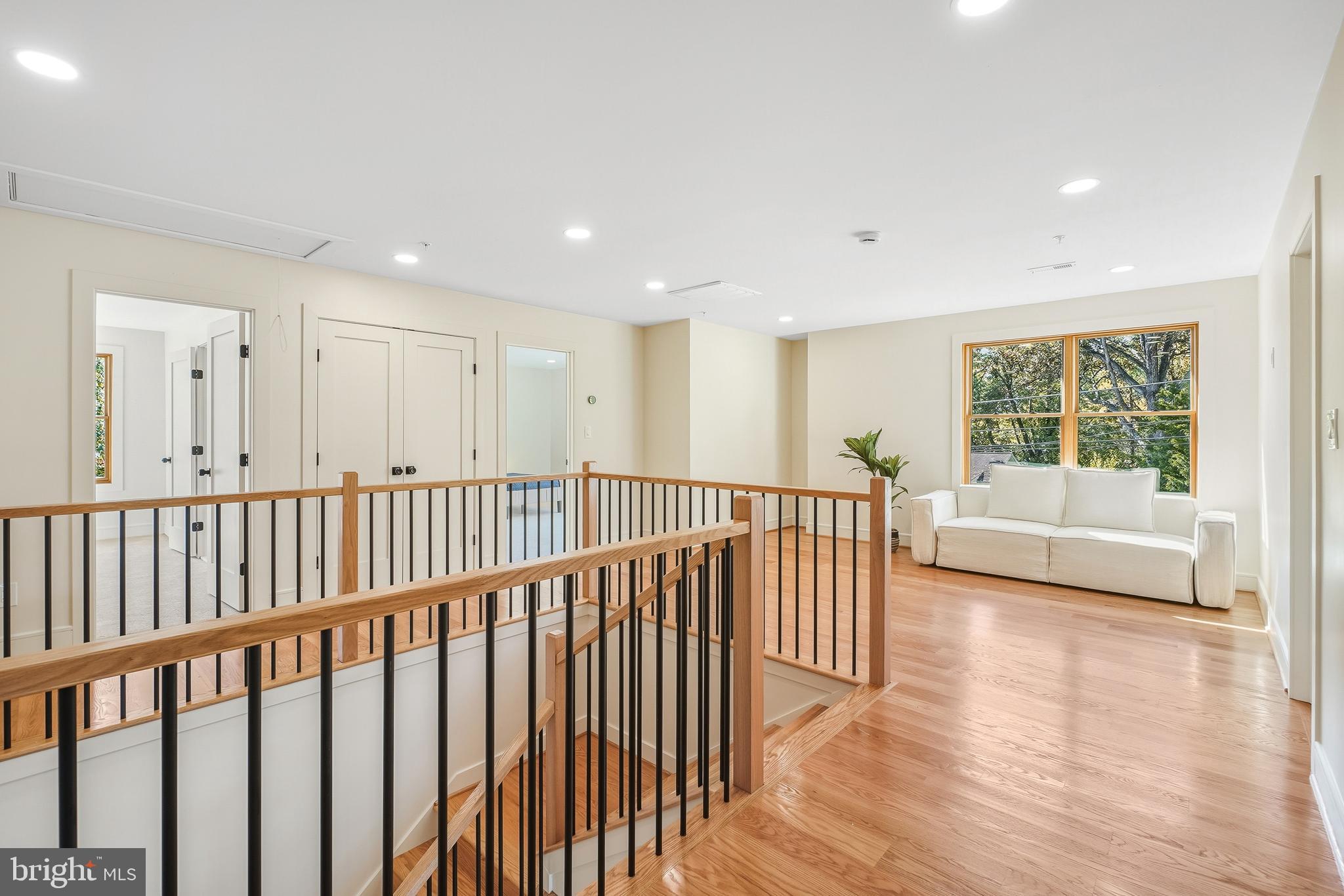 110 Geneva Avenue Silver Spring, MD 20910 - Photo 25 of 61 a view of a hallway with wooden floor and windows