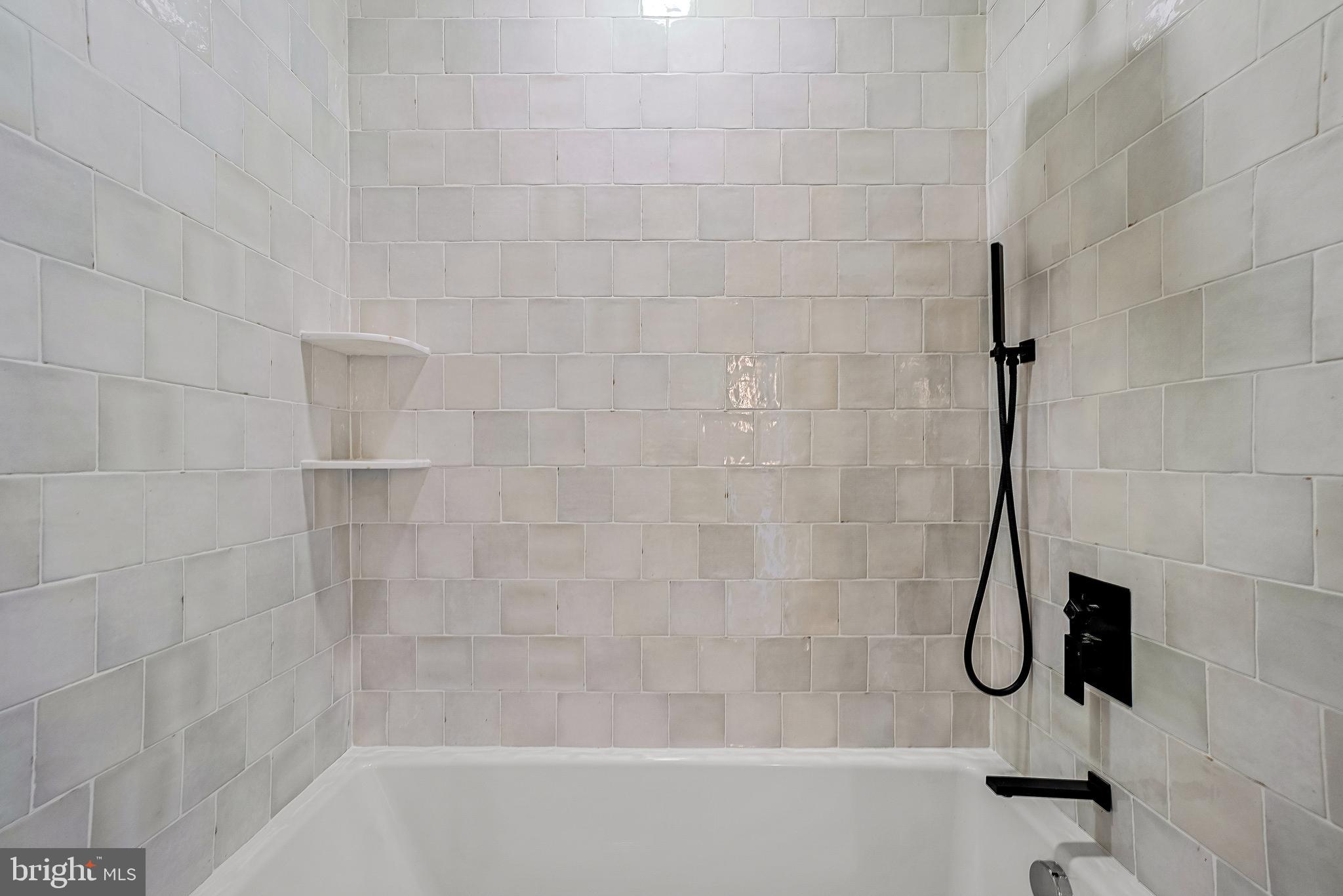 110 Geneva Avenue Silver Spring, MD 20910 - Photo 39 of 61 a bathroom with a bath tub with a shower