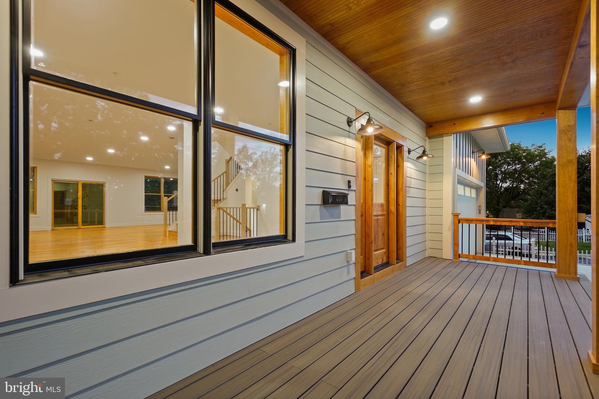 110 Geneva Avenue Silver Spring, MD 20910 - Photo 51 of 61 a view of a balcony with floor to ceiling window with wooden floor