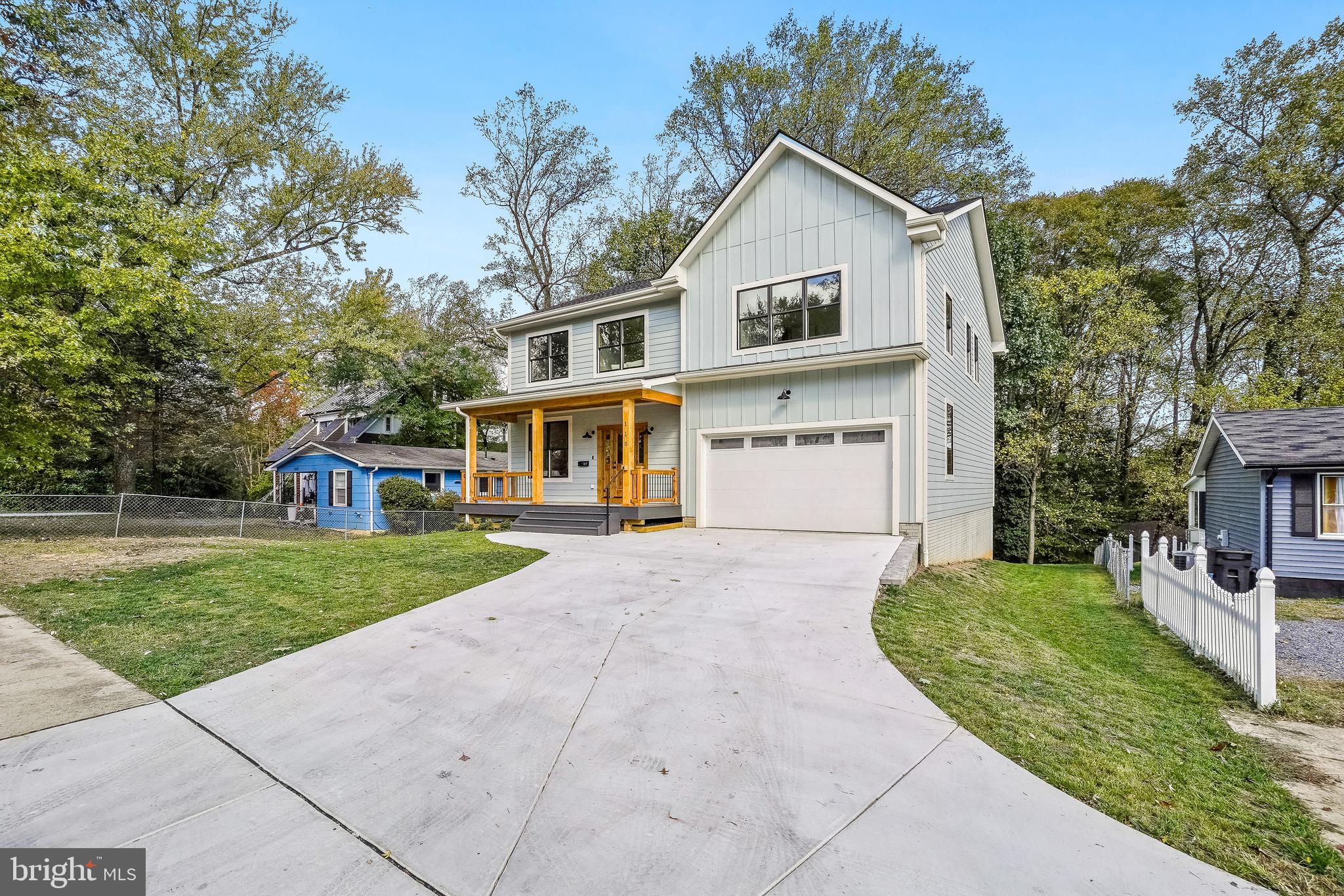 110 Geneva Avenue Silver Spring, MD 20910 - Photo 53 of 61 a front view of a house with a yard and trees