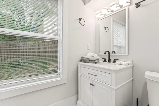 a view of a house with backyard and garden