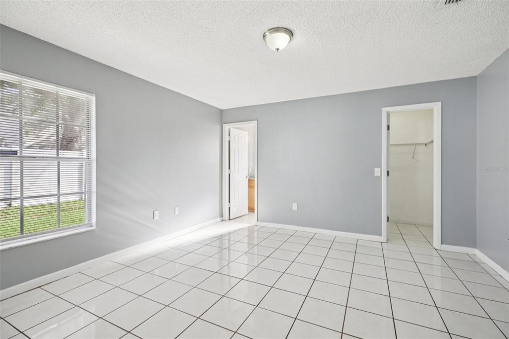 734 Bittern Lane Kissimmee, FL 34759 - Photo 11 of 55 a view of an empty room and window
