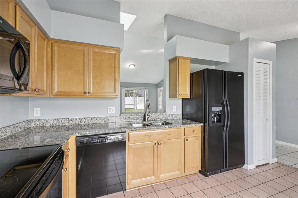734 Bittern Lane Kissimmee, FL 34759 - Photo 16 of 55 a kitchen with a sink cabinets and utility