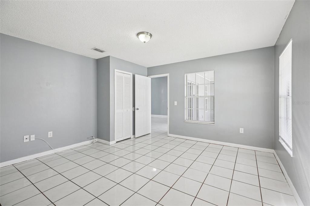 734 Bittern Lane Kissimmee, FL 34759 - Photo 17 of 55 a view of an empty room and window