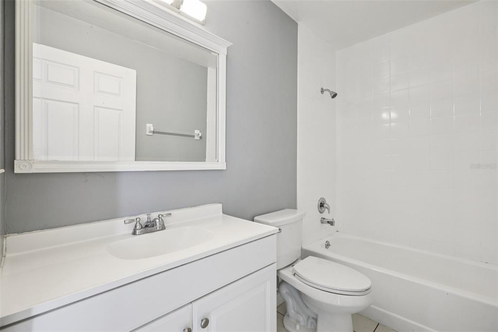 734 Bittern Lane Kissimmee, FL 34759 - Photo 21 of 55 a bathroom with a sink toilet vanity and tub