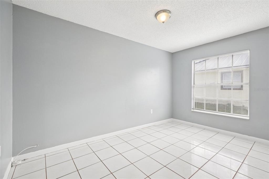 734 Bittern Lane Kissimmee, FL 34759 - Photo 22 of 55 a view of an empty room with window