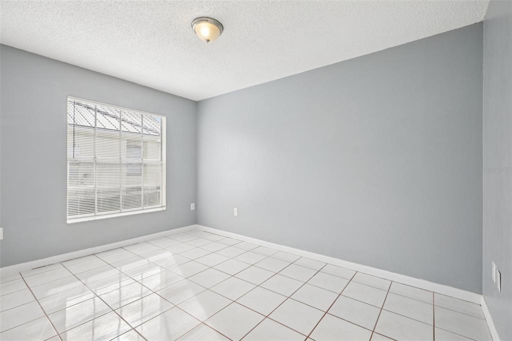 734 Bittern Lane Kissimmee, FL 34759 - Photo 25 of 55 an empty room with windows