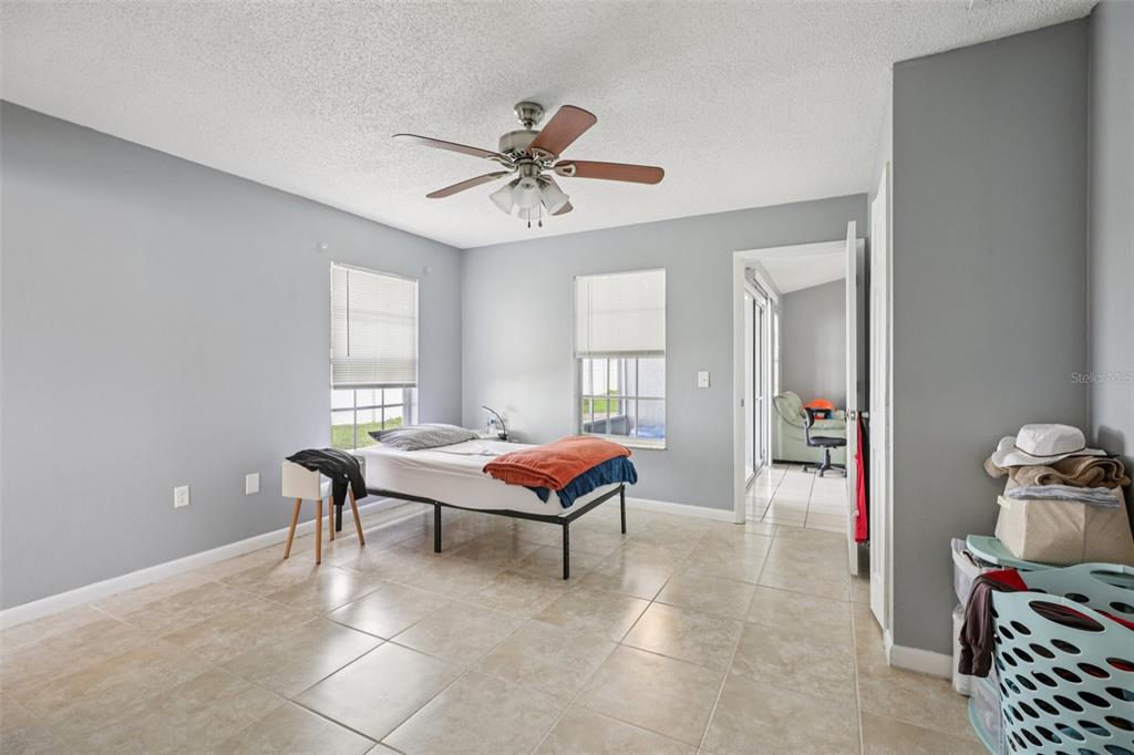 734 Bittern Lane Kissimmee, FL 34759 - Photo 30 of 55 a living room with furniture a rug and a window