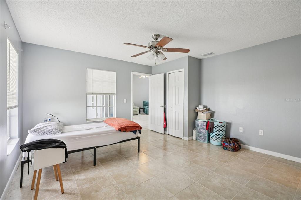 734 Bittern Lane Kissimmee, FL 34759 - Photo 31 of 55 a bedroom with furniture and a window