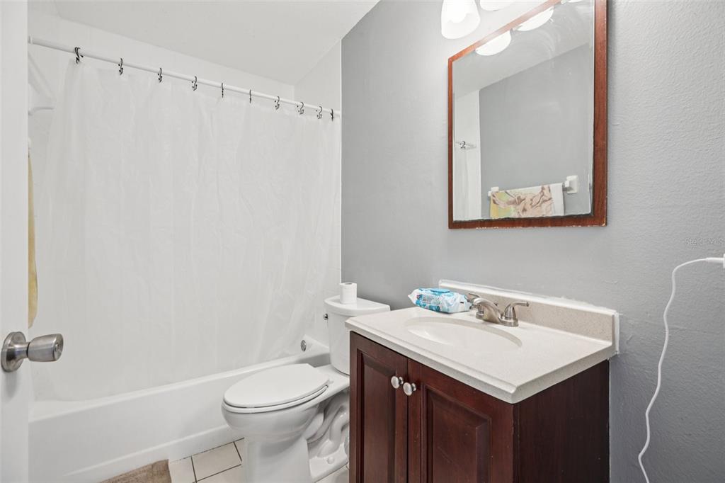 734 Bittern Lane Kissimmee, FL 34759 - Photo 33 of 55 a bathroom with a sink a toilet and shower