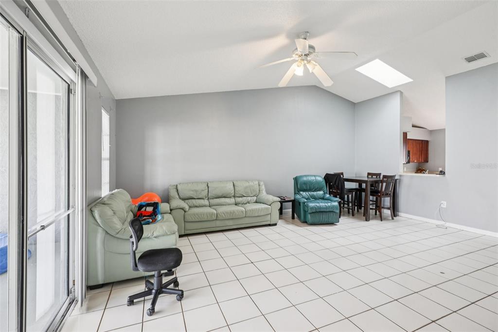 734 Bittern Lane Kissimmee, FL 34759 - Photo 39 of 55 a living room with furniture and wooden floor