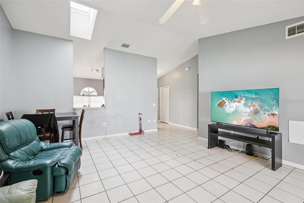 734 Bittern Lane Kissimmee, FL 34759 - Photo 40 of 55 a living room with furniture and a flat screen tv