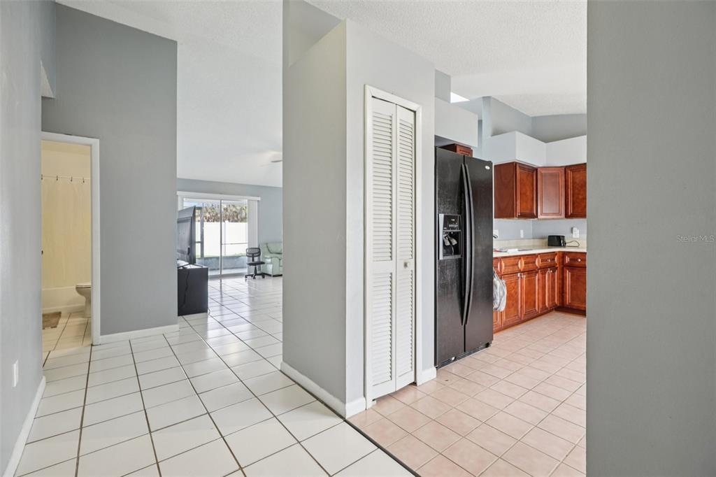734 Bittern Lane Kissimmee, FL 34759 - Photo 43 of 55 a view of kitchen with refrigerator and window