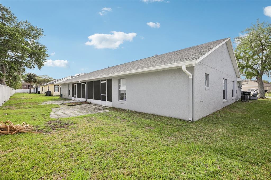 734 Bittern Lane Kissimmee, FL 34759 - Photo 55 of 55 a backyard of a house with table and chairs