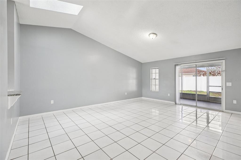 734 Bittern Lane Kissimmee, FL 34759 - Photo 7 of 55 a view of an empty room and window