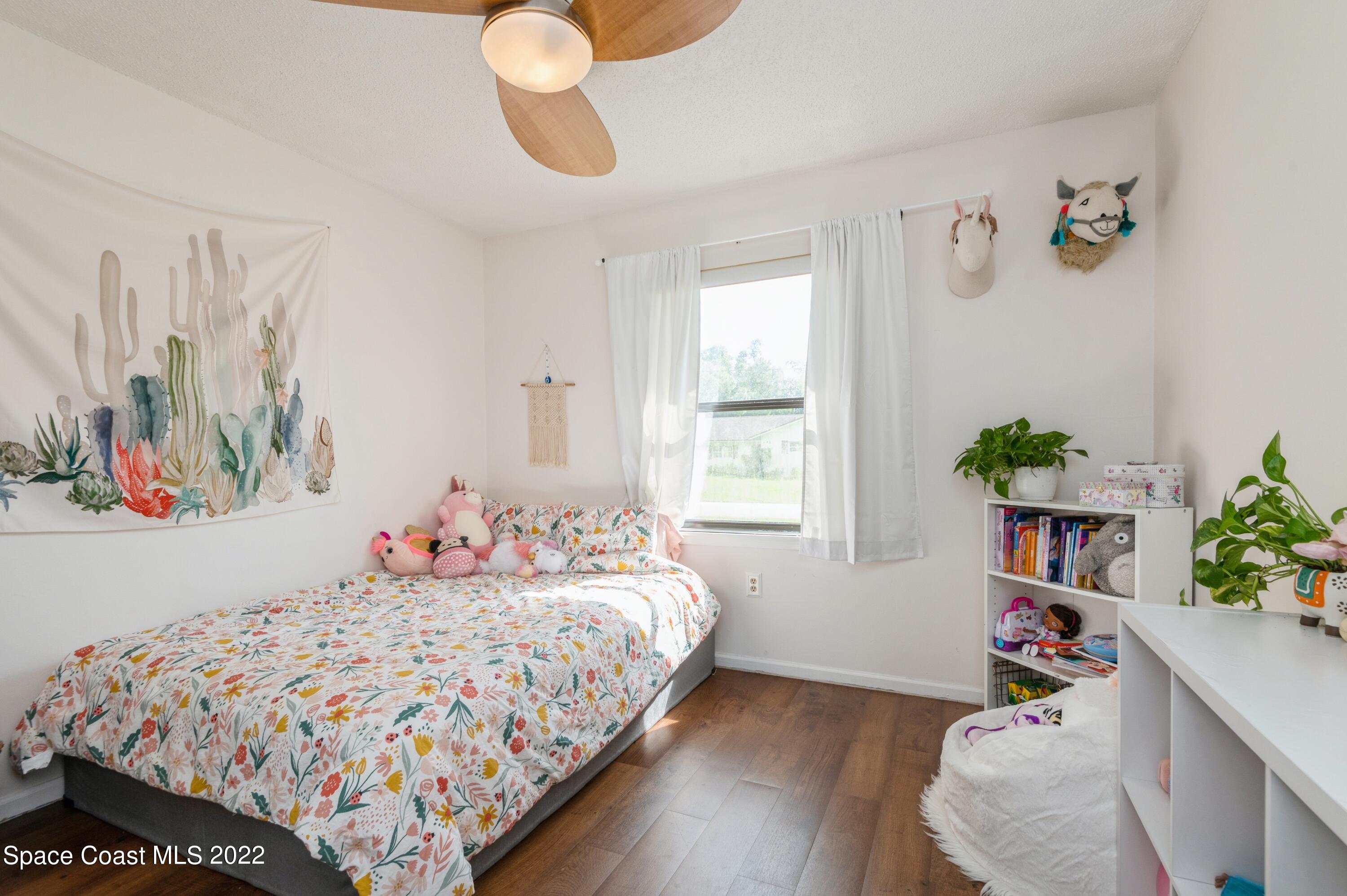 6480 Hudson Road Cocoa, FL 32927 - Photo 18 of 24 a bedroom with bed and a window