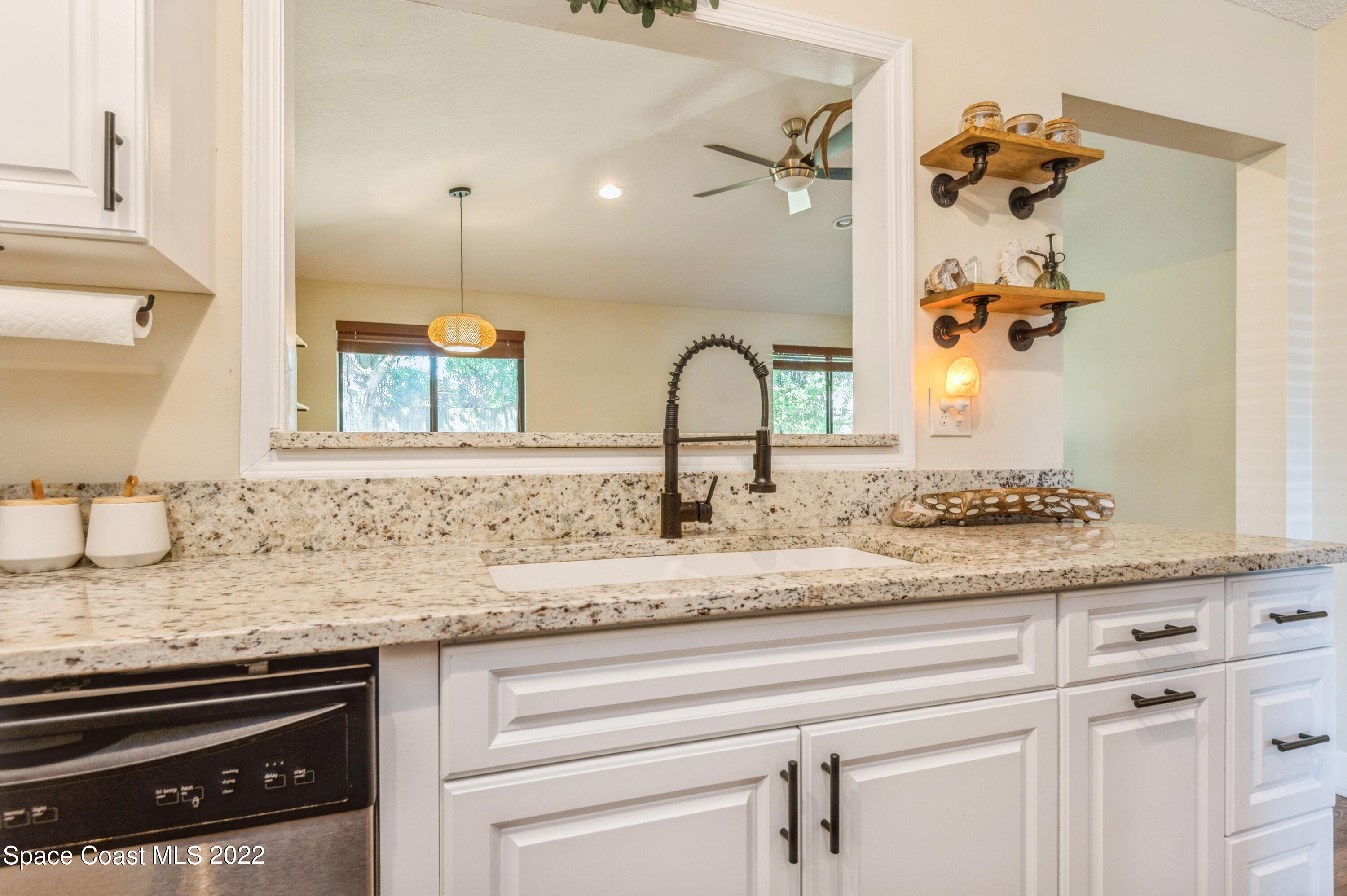 6480 Hudson Road Cocoa, FL 32927 - Photo 8 of 24 a bathroom with sink granite and mirror