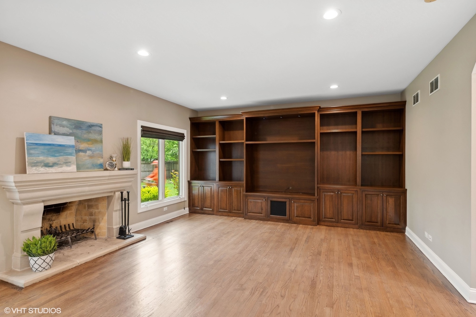 423 Sumac Road Highland Park, IL 60035 - Photo 12 of 31 a view of wooden floor fireplace and windows in an empty room