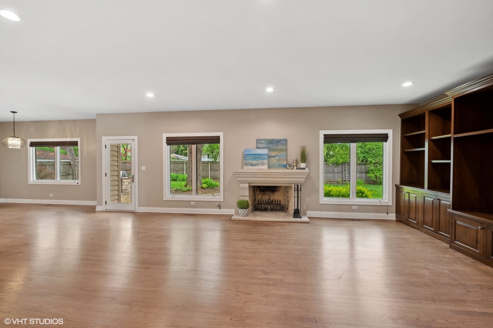 423 Sumac Road Highland Park, IL 60035 - Photo 13 of 31 a view of an empty room with wooden floor and a window