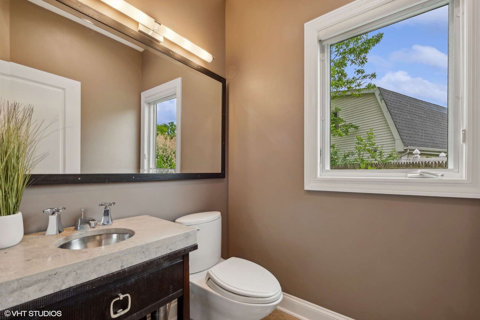 423 Sumac Road Highland Park, IL 60035 - Photo 14 of 31 a bathroom with a granite countertop sink mirror vanity and toilet