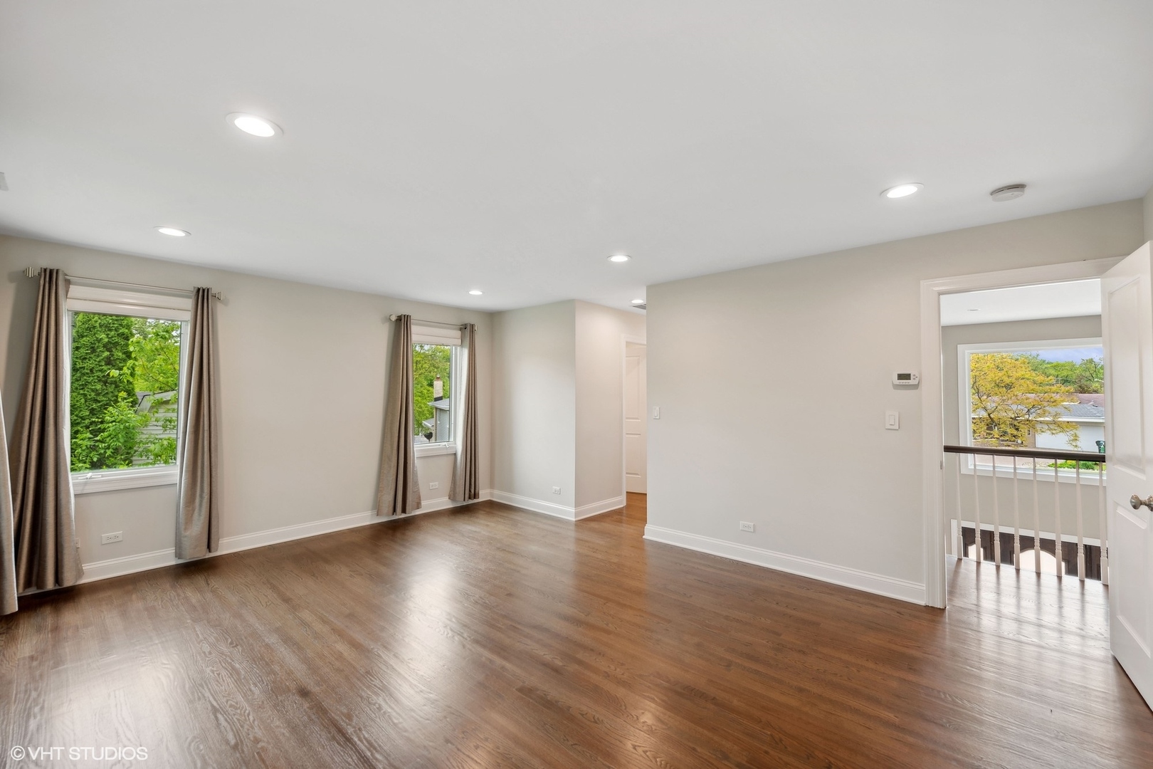 423 Sumac Road Highland Park, IL 60035 - Photo 16 of 31 a view of an empty room with wooden floor and a window