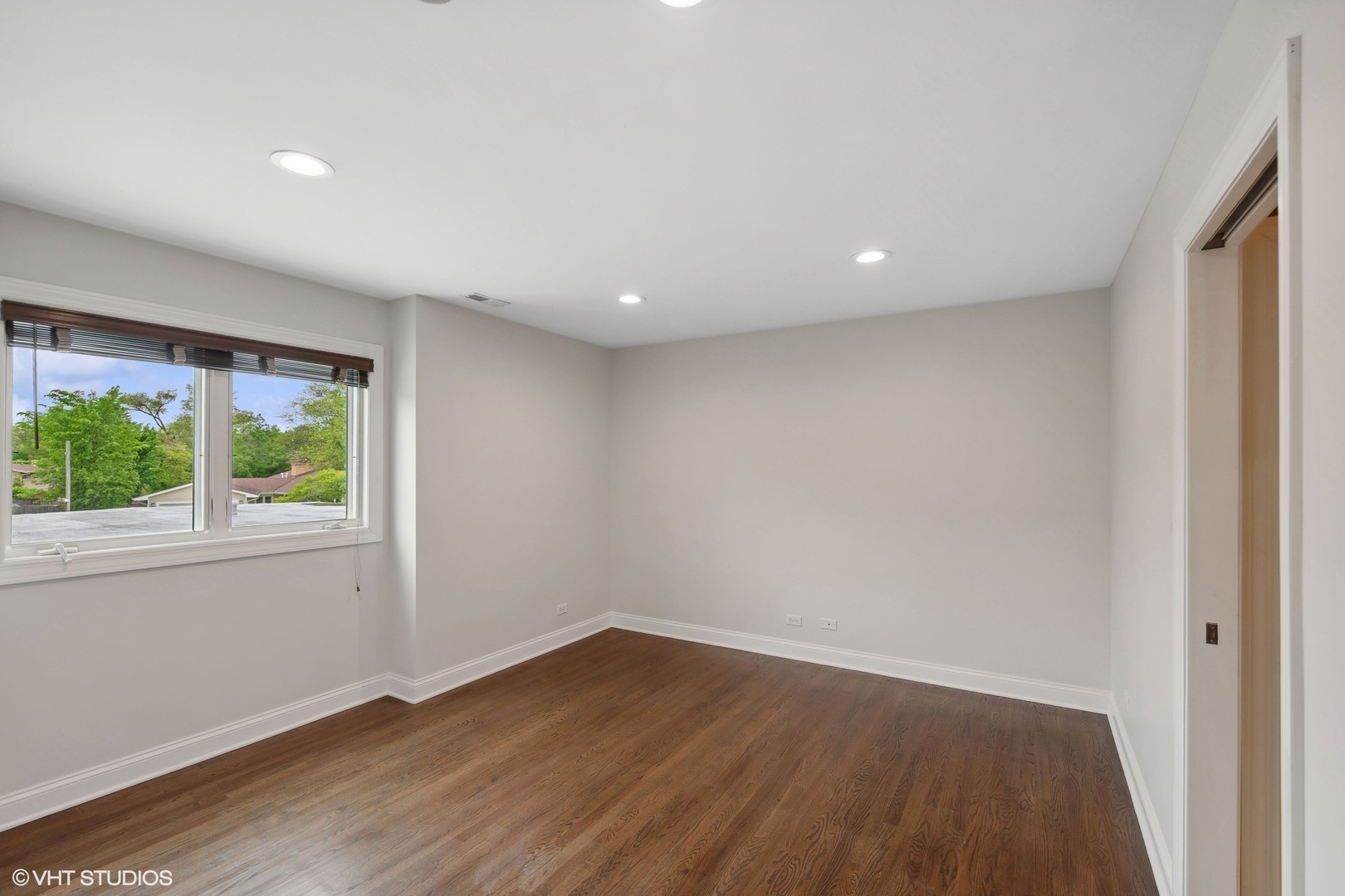 423 Sumac Road Highland Park, IL 60035 - Photo 19 of 31 an empty room with wooden floor and windows