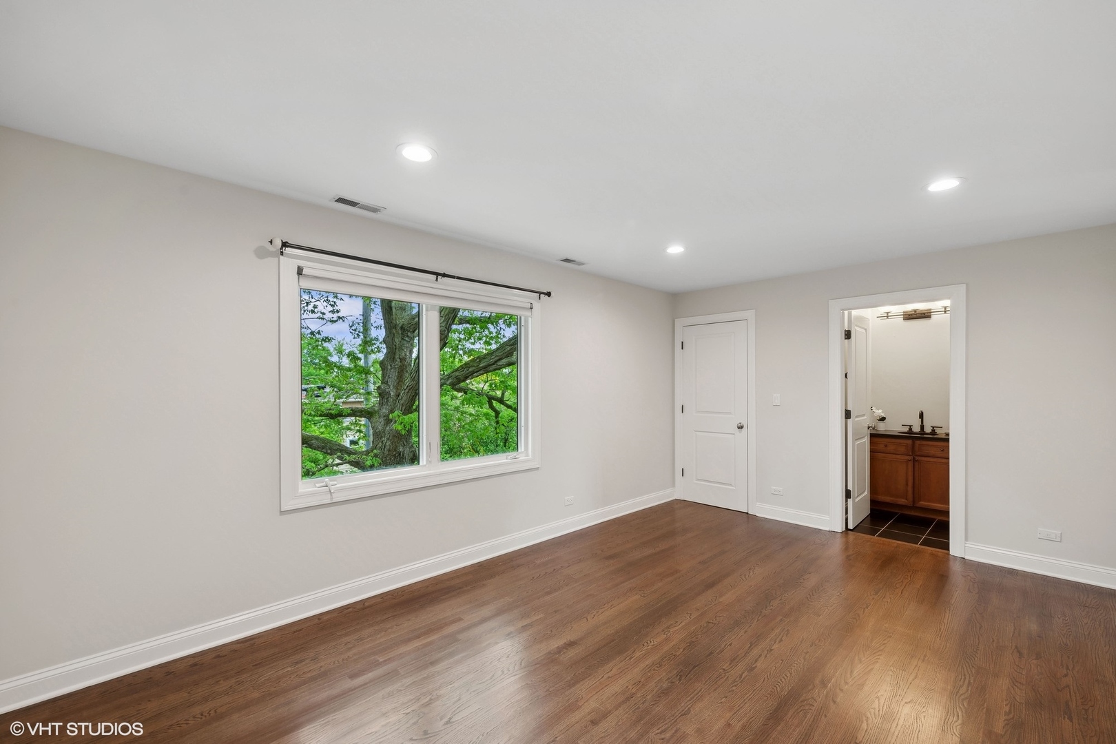 423 Sumac Road Highland Park, IL 60035 - Photo 23 of 31 an empty room with wooden floor and windows