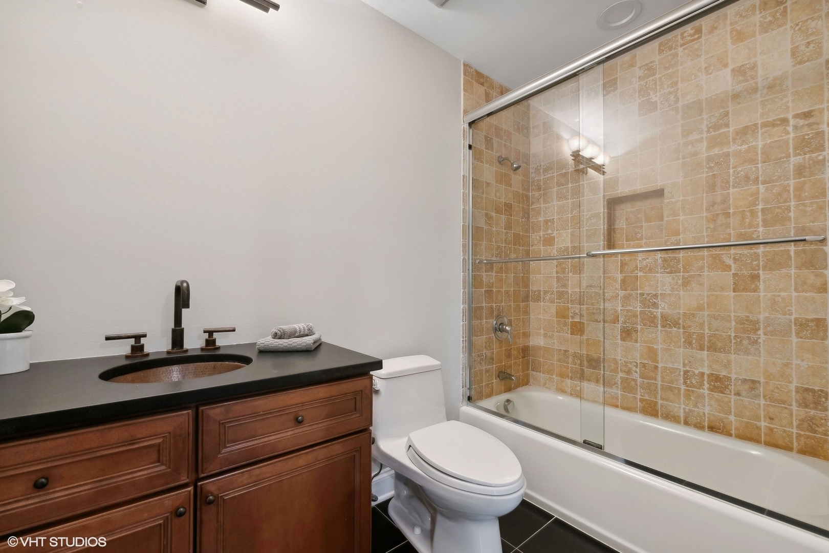 423 Sumac Road Highland Park, IL 60035 - Photo 24 of 31 a bathroom with a granite countertop sink a toilet and shower