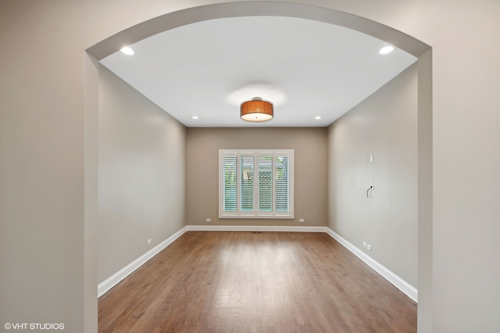 423 Sumac Road Highland Park, IL 60035 - Photo 5 of 31 a view of an empty room with wooden floor and a window