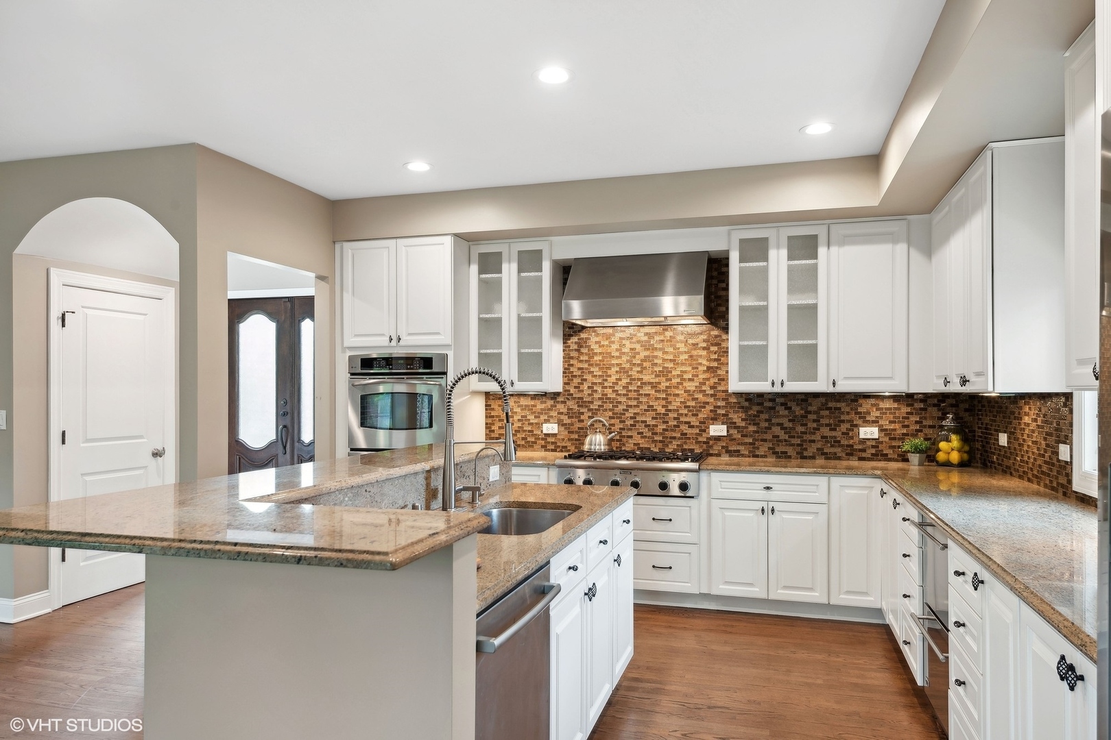423 Sumac Road Highland Park, IL 60035 - Photo 8 of 31 a kitchen with a sink stove and cabinets