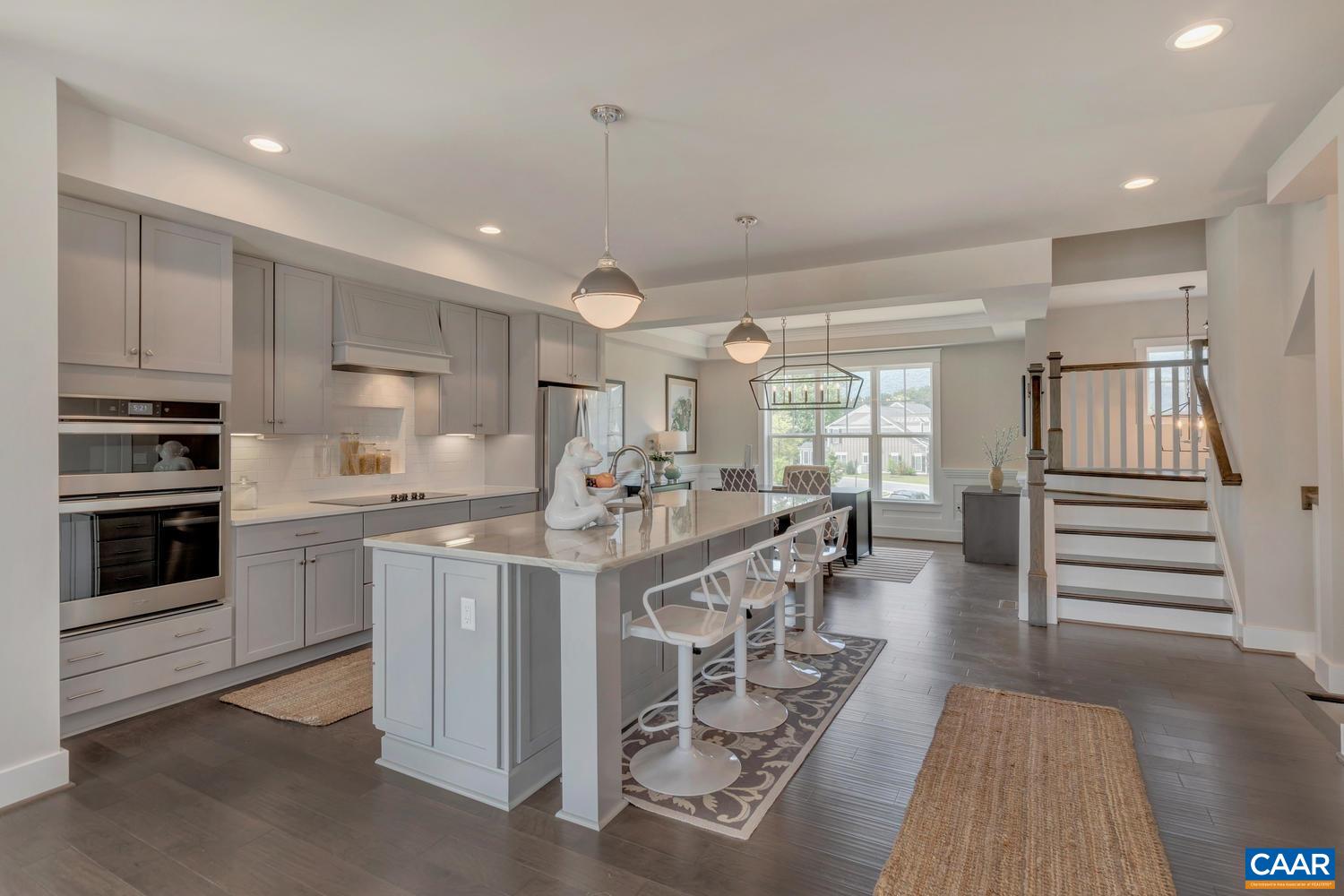3518 Rowcross Street Crozet, VA 22932 - Photo 11 of 50 a kitchen with stainless steel appliances kitchen island granite countertop a stove and a sink