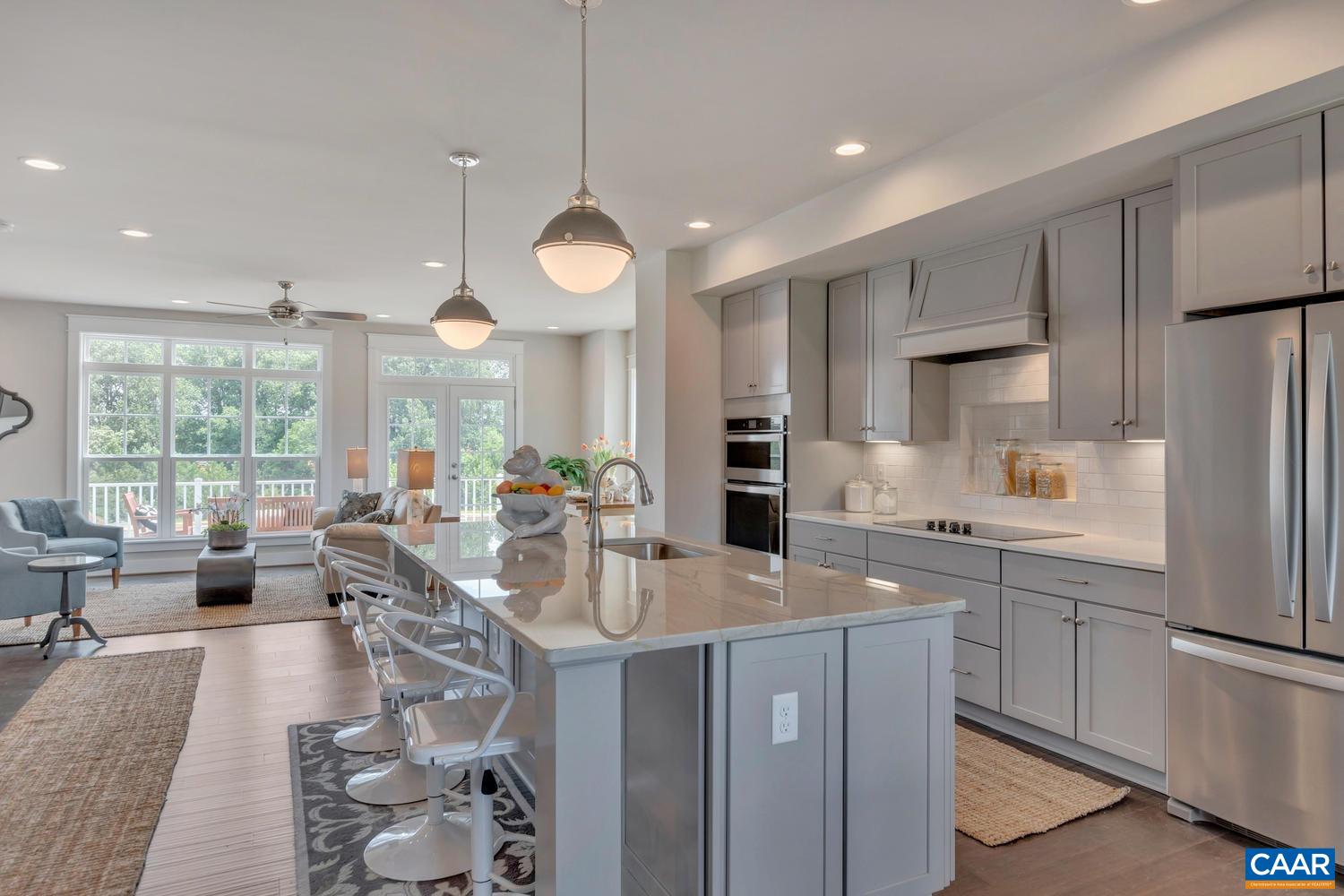3518 Rowcross Street Crozet, VA 22932 - Photo 13 of 50 a very nice looking open dining room with kitchen island furniture a large window and a refrigerator