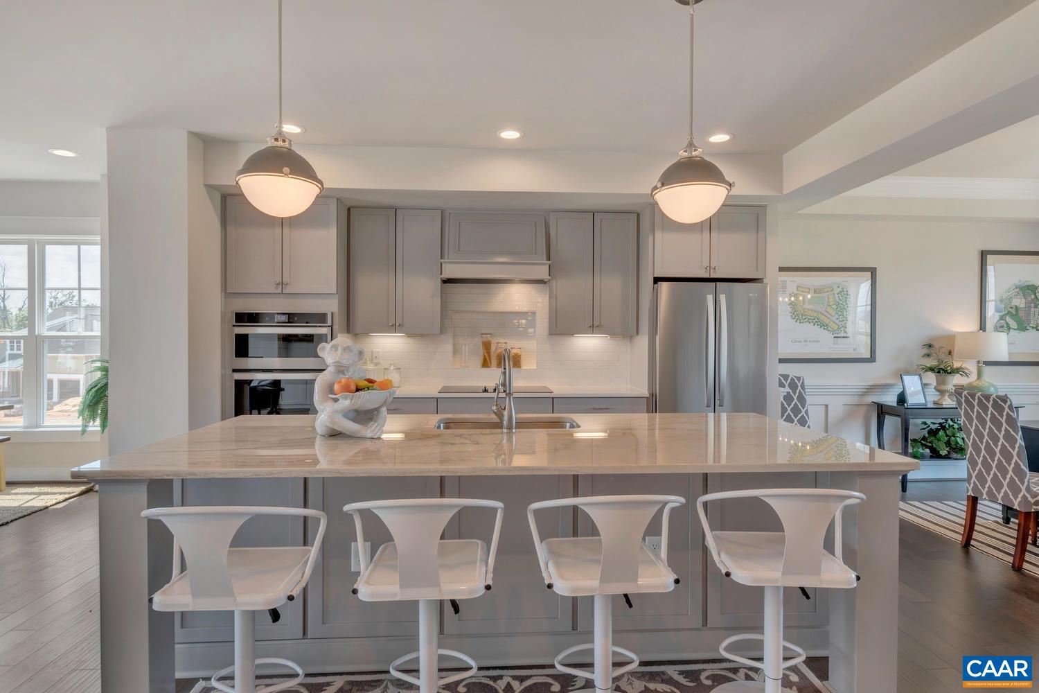 3518 Rowcross Street Crozet, VA 22932 - Photo 14 of 50 a kitchen with kitchen island granite countertop a table and chairs in it