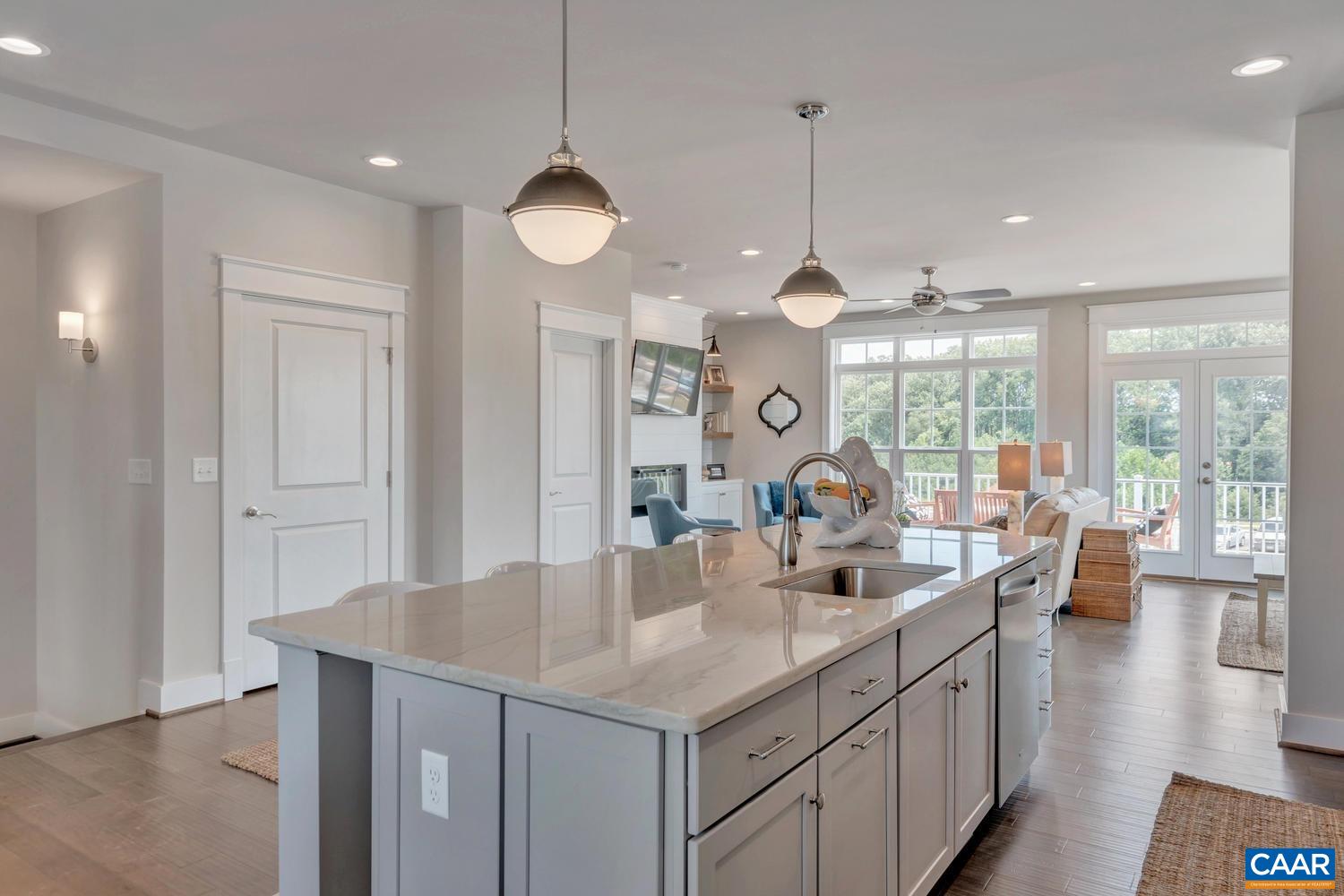 3518 Rowcross Street Crozet, VA 22932 - Photo 15 of 50 a kitchen with counter top space a sink and living room view