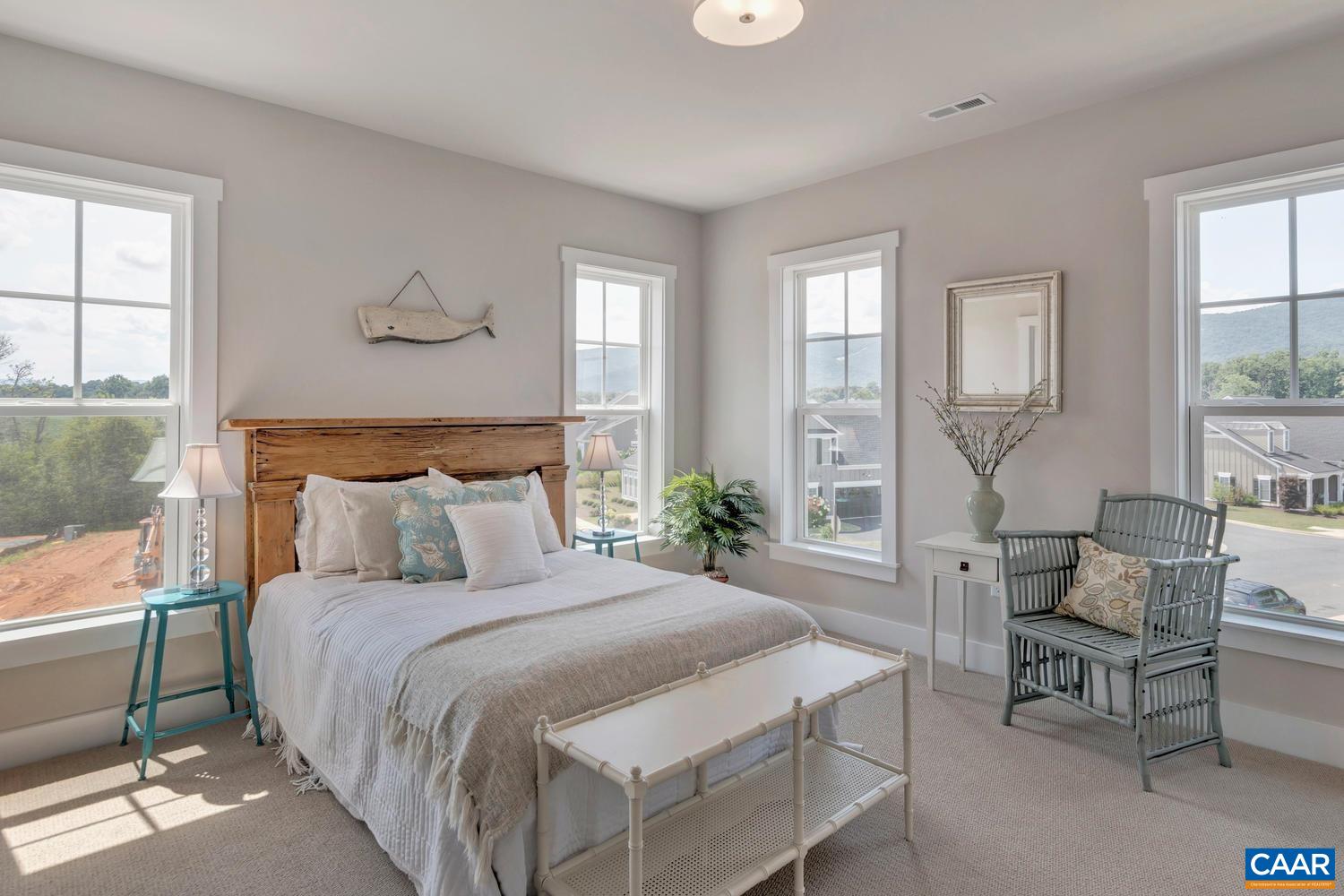 3518 Rowcross Street Crozet, VA 22932 - Photo 25 of 50 a bedroom with a large bed and windows