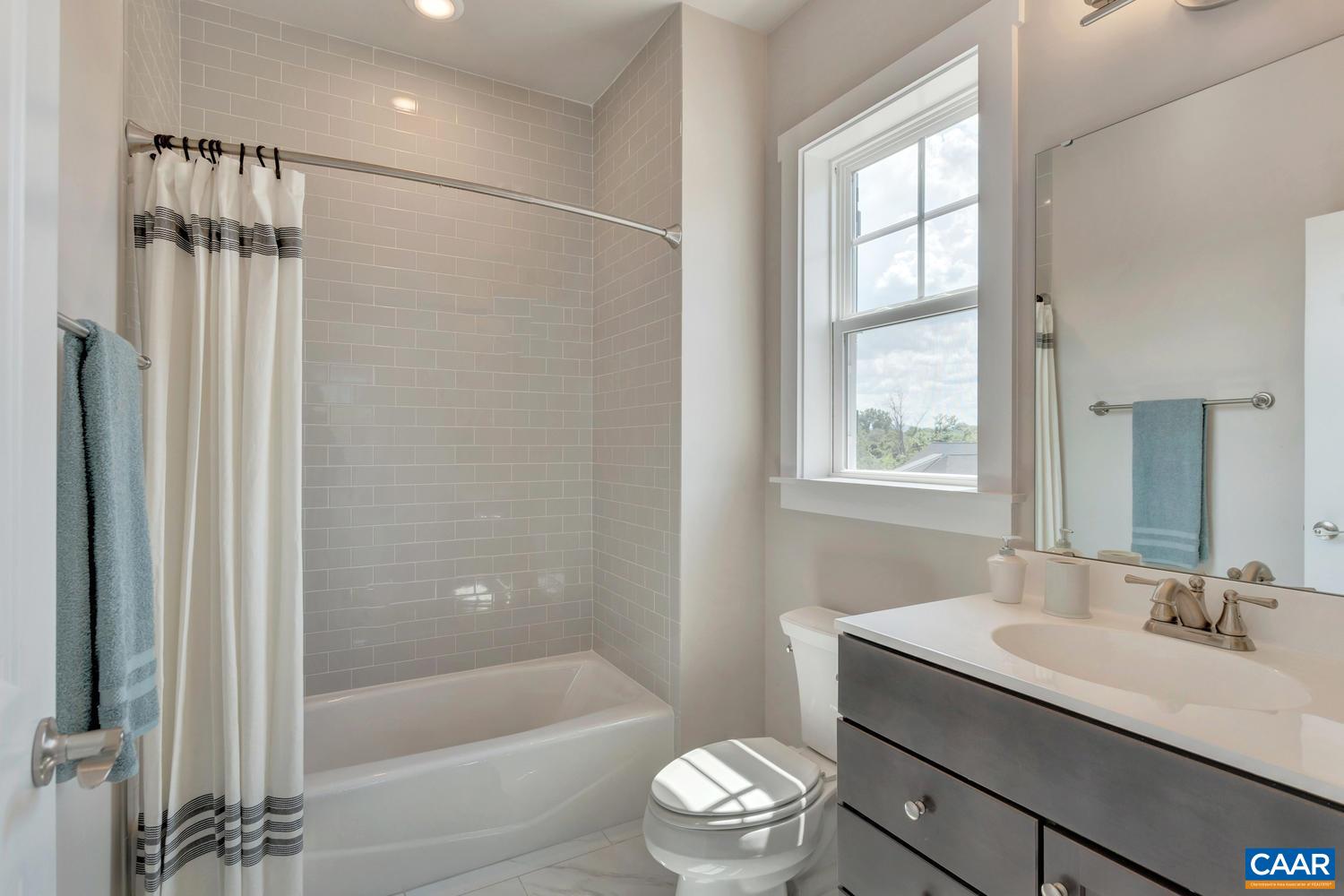 3518 Rowcross Street Crozet, VA 22932 - Photo 26 of 50 a bathroom with a sink toilet a mirror and shower
