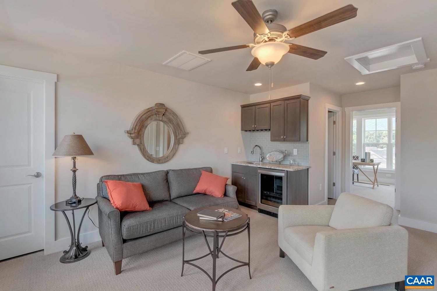3518 Rowcross Street Crozet, VA 22932 - Photo 27 of 50 a living room with furniture a fireplace and a chandelier
