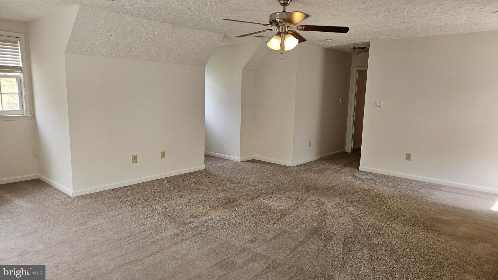 10495 Green Leaf Place La Plata, MD 20646 - Photo 11 of 24 an empty room with windows and fan
