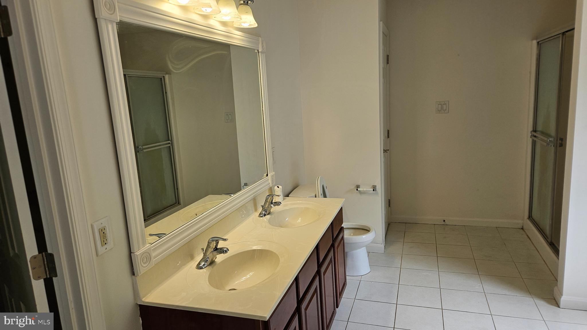 10495 Green Leaf Place La Plata, MD 20646 - Photo 13 of 24 a bathroom with a sink a vanity and a mirror
