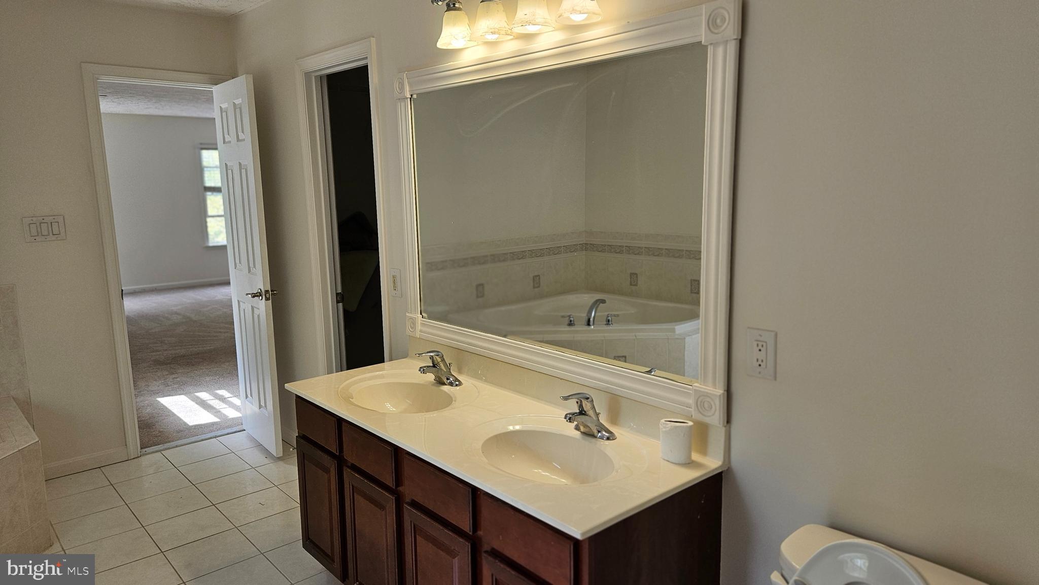 10495 Green Leaf Place La Plata, MD 20646 - Photo 14 of 24 a bathroom with a sink a toilet and shower