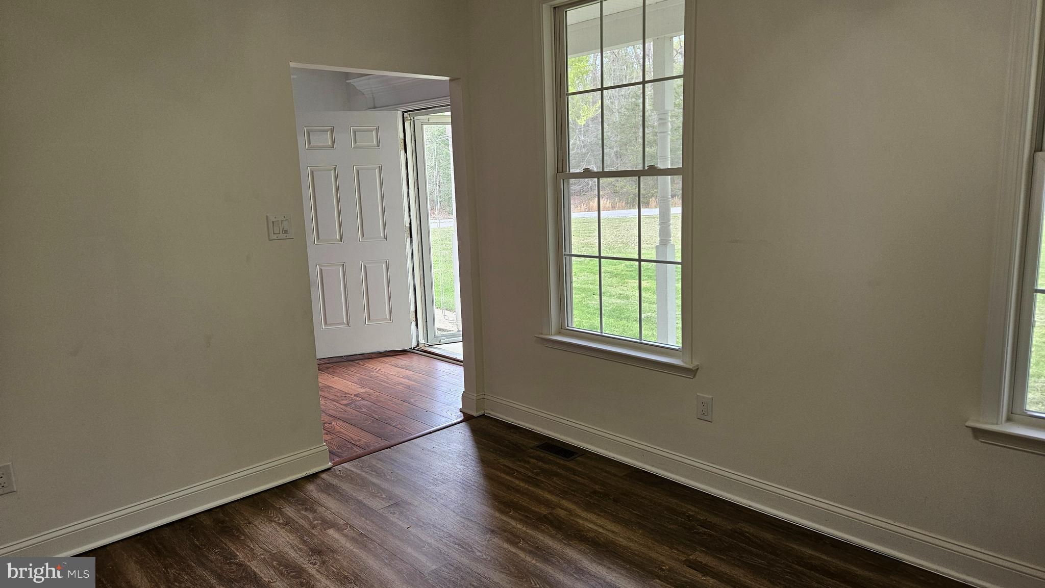 10495 Green Leaf Place La Plata, MD 20646 - Photo 4 of 24 an empty room with wooden floor and windows