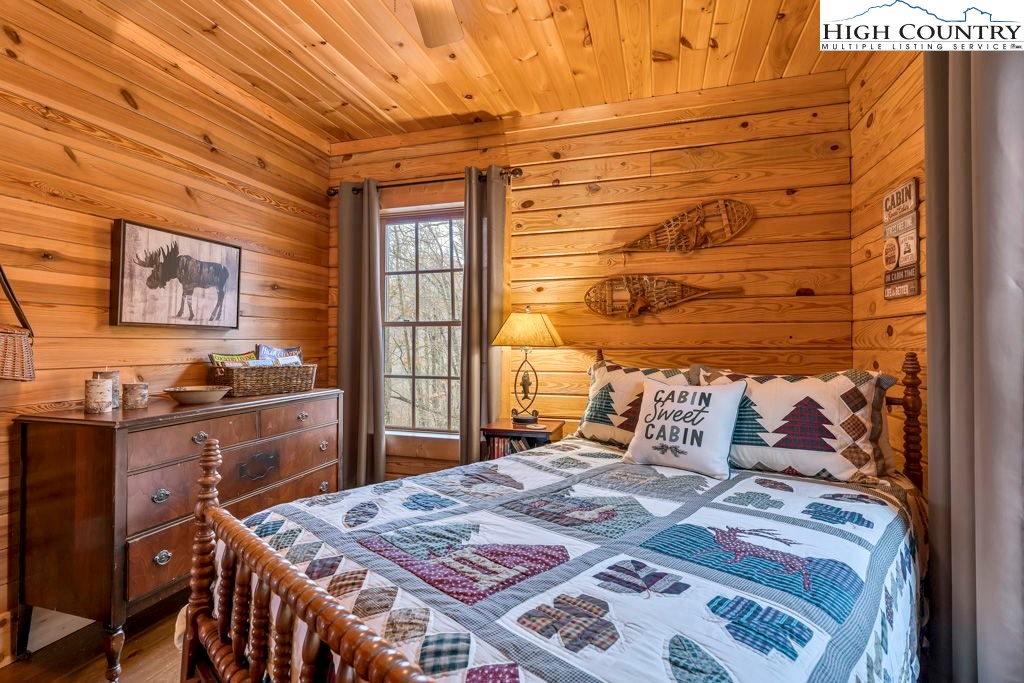 3043 Junaluska Road Boone, NC 28607 - Photo 23 of 49 a bedroom with a bed and a dresser