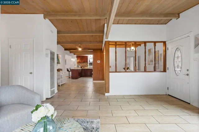 a room with gym equipment and a rug