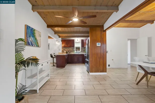 a view of a dining room with furniture wooden floor and chandelier