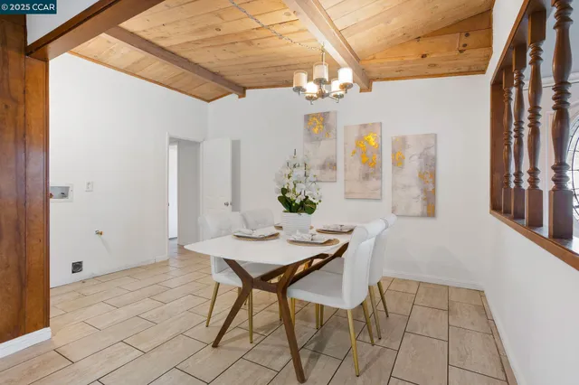 a kitchen with stainless steel appliances granite countertop a refrigerator and a stove