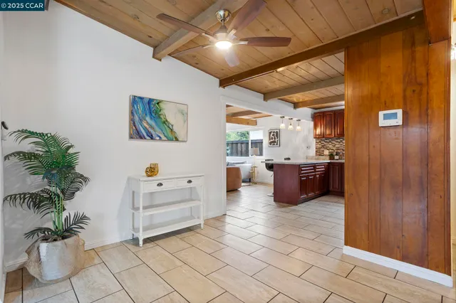 a kitchen with stainless steel appliances granite countertop wooden cabinets a sink and dishwasher